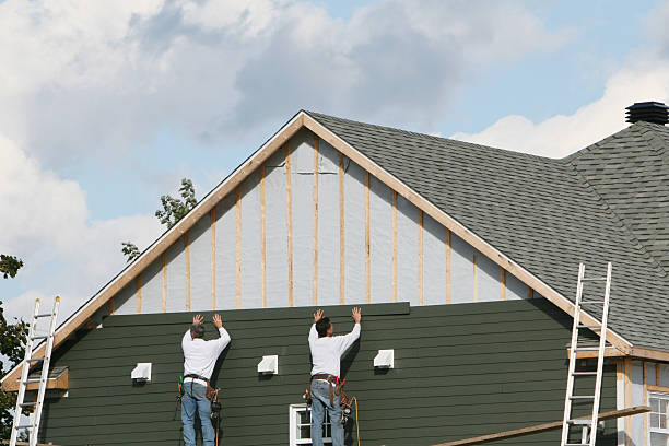 Professional Storm Damage Siding Repair technician working in Selden, NY